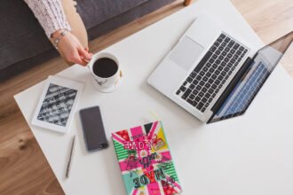 The Rise of Side Hustles: How Gen Z Is Redefining Work top view laptop coffee table 1